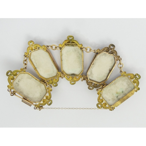 13 - Victorian gilt metal bracelet set with five hand painted porcelain panels, 50 grams. 52 mm x 17 cm. ... 