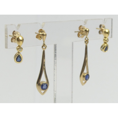 16 - A pair of 18ct gold sapphire and diamond earrings and a pair of 9ct gold sapphire drop examples, 4.8... 