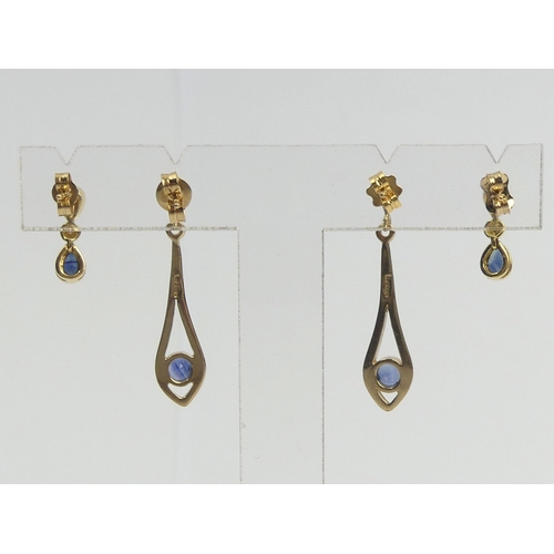 16 - A pair of 18ct gold sapphire and diamond earrings and a pair of 9ct gold sapphire drop examples, 4.8... 
