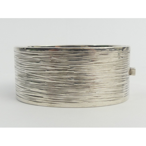 17 - Stylish Sterling silver textured finish hinged bangle, 114 grams. 30 mm wide. UK Postage £12.
