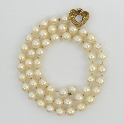 18 - A 46 cm cultured pearl necklace with a 9ct gold clasp, London 1961. 6.8 mm pearls. UK Postage £12.