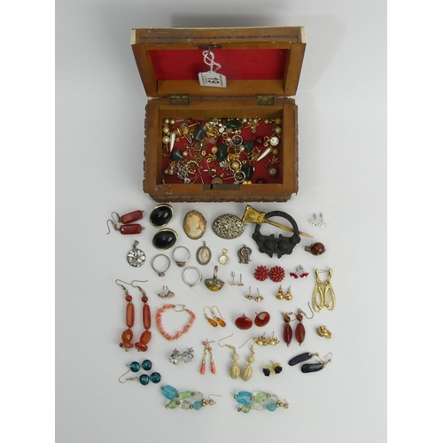 19 - A box of costume and silver jewellery including a Celtic design kilt pin. UK Postage £12.