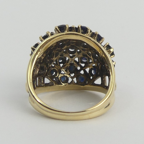 21 - 9ct gold sapphire bombe design ring, 7.5 grams, Birm.1963. Size M, 18.5 mm. UK Postage £12.