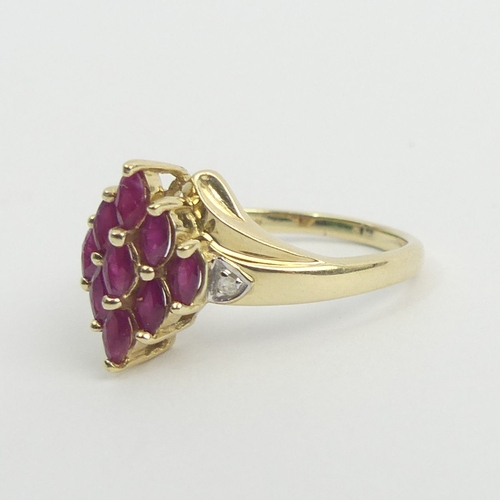 22 - 9ct gold ruby and diamond ring, 3.2 grams. Size S, 13.4 mm wide. UK Postage £12.