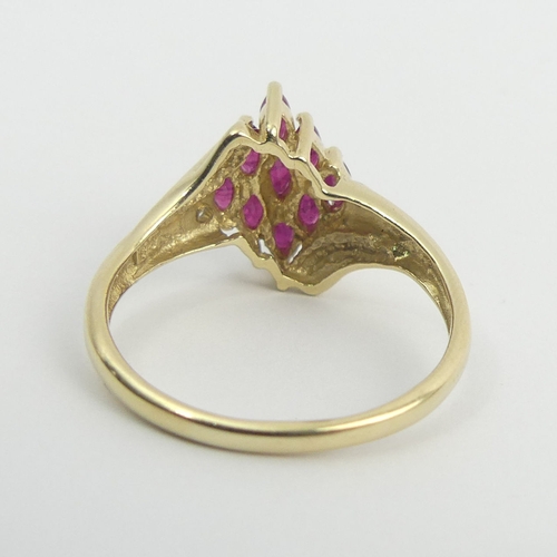 22 - 9ct gold ruby and diamond ring, 3.2 grams. Size S, 13.4 mm wide. UK Postage £12.
