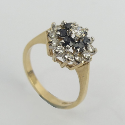 4 - 9ct gold sapphire and c.z cluster ring, 3 grams. Size M, 11.9 mm. Uk Postage £12.