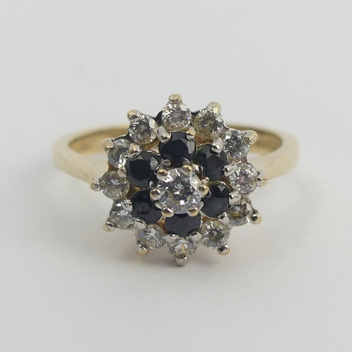 4 - 9ct gold sapphire and c.z cluster ring, 3 grams. Size M, 11.9 mm. Uk Postage £12.