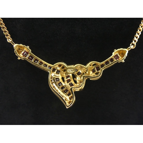 5 - 18ct gold ruby and diamond necklace, 9.2 grams. 45 cm long, centre 40 mm. Uk Postage £12.