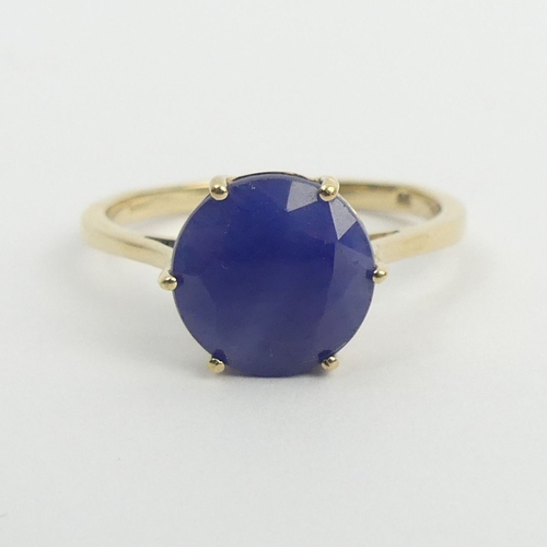 26 - 9ct gold sapphire solitaire ring, 2.6 grams. Size S, 10 mm wide. UK Postage £12.