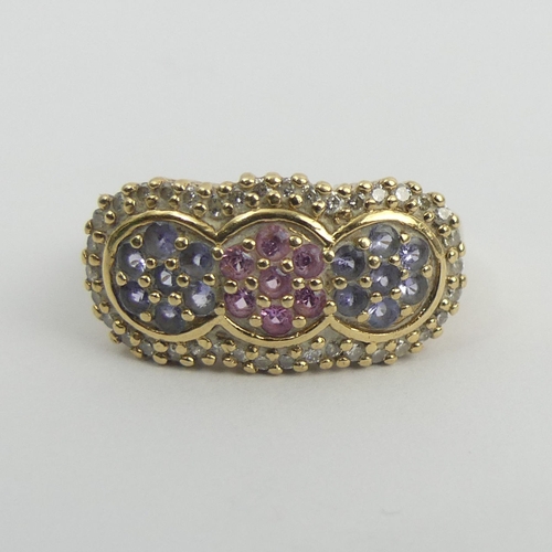 29 - 9ct gold ruby, tanzanite and diamond ring, 4 grams. Size T, 11.3 mm. UK Postage £12.