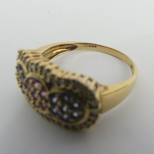 29 - 9ct gold ruby, tanzanite and diamond ring, 4 grams. Size T, 11.3 mm. UK Postage £12.