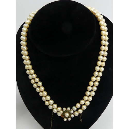 32 - Cultured pearl double strand necklace with a 9ct gold clasp, set with turquoise and pearls, 89 grams... 