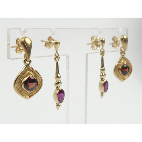33 - Two pairs of 9ct gold drop earrings, one pair set with garnets the other rubies, 5.7 grams. UK Posta... 