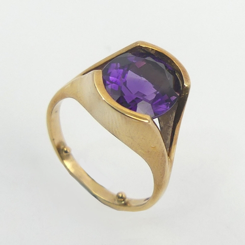 34 - 9ct gold tension set amethyst single stone ring, 5.7 grams. Size N 1/2 with reducers, 14.24 mm wide.... 