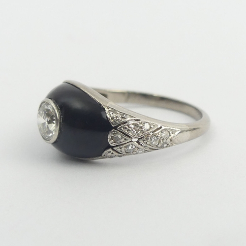 39 - Platinum tested onyx and diamond (centre approx. 1/2ct) ring, 3.5 grams. Size M, 9.3 mm wide. UK Pos... 