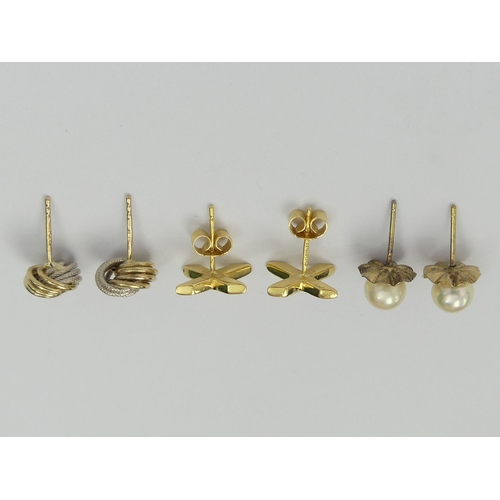 42 - A pair of 18ct gold cross design diamond earrings, a pair of 9ct gold knot earrings and a pair of cu... 