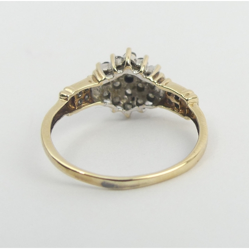 45 - 9ct gold .5ct diamond cluster ring, 2.4 grams. Size Q, 10.8 mm wide. UK Postage £12.