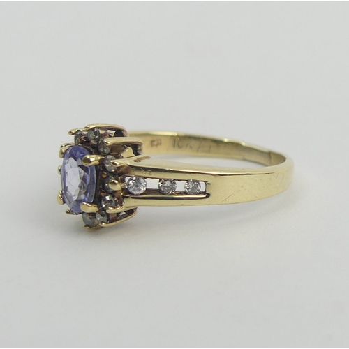 46 - 10ct gold tanzanite and diamond ring, 3.1 grams. Size P 1/2, 9.9 mm wide. UK Postage £12.