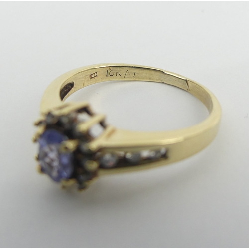 46 - 10ct gold tanzanite and diamond ring, 3.1 grams. Size P 1/2, 9.9 mm wide. UK Postage £12.