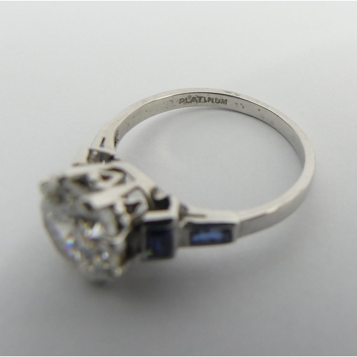 50 - Platinum c.z and sapphire ring, 3.5 grams. Size J 1/2, 8.6 mm wide. UK Postage £12.