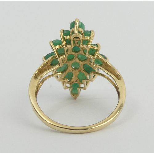 56 - 9ct gold emerald marquise form ring, 2.7 grams. Size N 1/2, 22.5 mm wide. UK Postage £12.