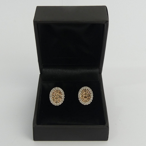 57 - A pair of 9ct gold cognac and white diamond earrings, 2.7 grams. 11.25 mm. UK Postage £12.