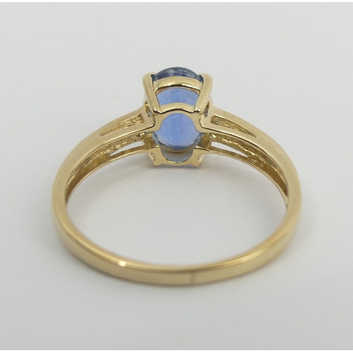 58 - 9ct gold blue topaz and diamond ring, 2 grams. Size N, 8.1 mm wide. UK Postage £12.
