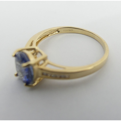 58 - 9ct gold blue topaz and diamond ring, 2 grams. Size N, 8.1 mm wide. UK Postage £12.