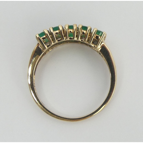 59 - 9ct gold two row emerald ring, 2.7 grams. Size N 1/2, 7.5 mm. UK Postage £12.