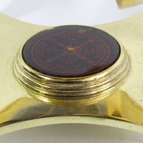 271 - A gilt metal table-top globe with compass inset to the base, 24 cm. UK Postage £14.