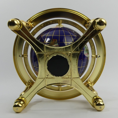 271 - A gilt metal table-top globe with compass inset to the base, 24 cm. UK Postage £14.