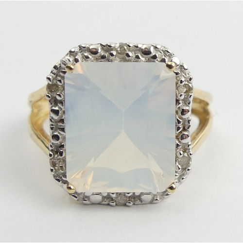 10 - 9ct gold white quartz and diamond ring, 3.4 grams. Size N 1/2, 15.5 mm. UK Postage £12.