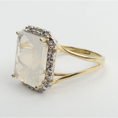 10 - 9ct gold white quartz and diamond ring, 3.4 grams. Size N 1/2, 15.5 mm. UK Postage £12.