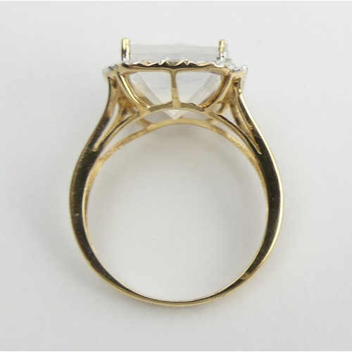 10 - 9ct gold white quartz and diamond ring, 3.4 grams. Size N 1/2, 15.5 mm. UK Postage £12.