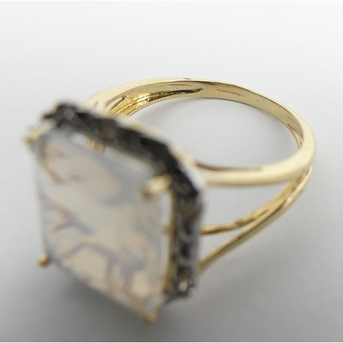 10 - 9ct gold white quartz and diamond ring, 3.4 grams. Size N 1/2, 15.5 mm. UK Postage £12.