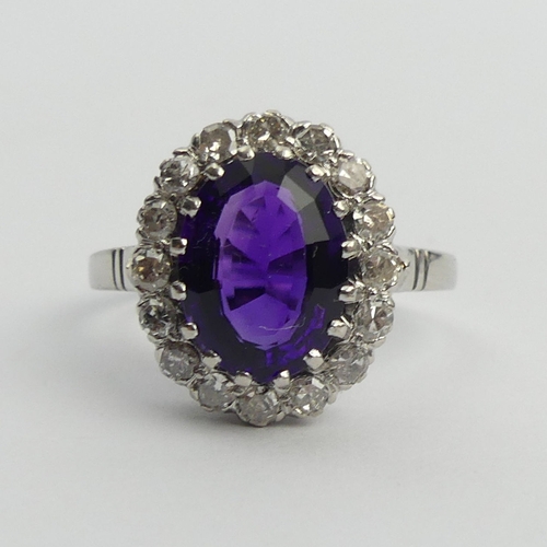 19 - 850 Platinum amethyst and diamond cluster ring, 9 grams. Size U, 17.1 mm. UK Postage £12.