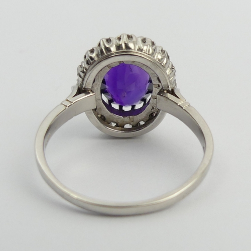 19 - 850 Platinum amethyst and diamond cluster ring, 9 grams. Size U, 17.1 mm. UK Postage £12.