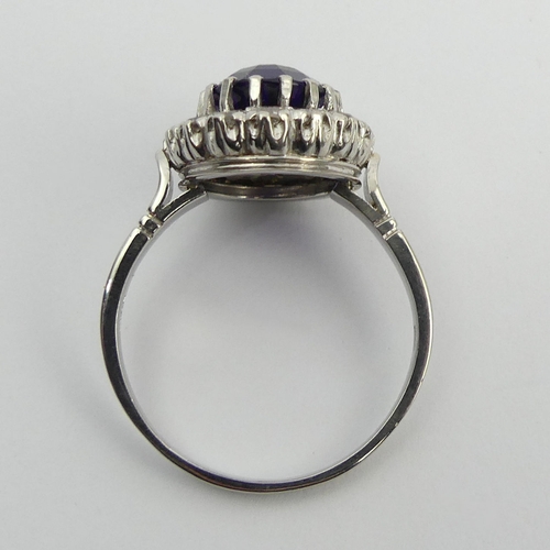 19 - 850 Platinum amethyst and diamond cluster ring, 9 grams. Size U, 17.1 mm. UK Postage £12.