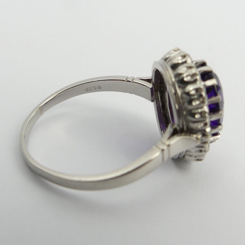 19 - 850 Platinum amethyst and diamond cluster ring, 9 grams. Size U, 17.1 mm. UK Postage £12.