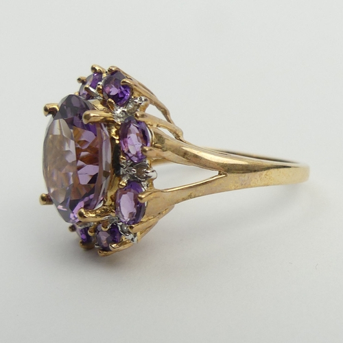 6 - 9ct gold amethyst and diamond cluster ring, 4.8 grams. Size N 1/2, 18.2 mm. UK Postage £12.