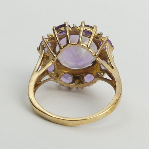 6 - 9ct gold amethyst and diamond cluster ring, 4.8 grams. Size N 1/2, 18.2 mm. UK Postage £12.