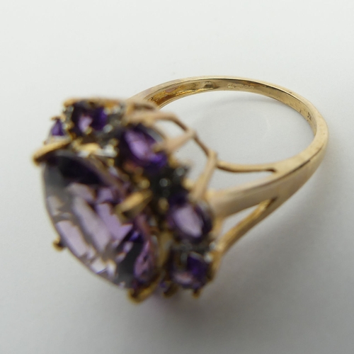 6 - 9ct gold amethyst and diamond cluster ring, 4.8 grams. Size N 1/2, 18.2 mm. UK Postage £12.