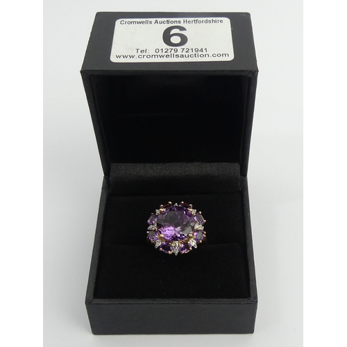 6 - 9ct gold amethyst and diamond cluster ring, 4.8 grams. Size N 1/2, 18.2 mm. UK Postage £12.