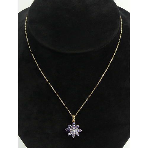 7 - 9ct gold tanzanite pendant and chain, 2.5 grams. Pendant 23 mm long. UK Postage £12.