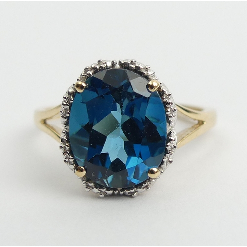 8 - 9ct gold blue topaz ring, 2.9 grams. Size N 1/2, 11 mm. UK Postage £12.