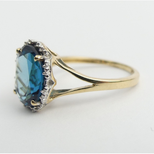 8 - 9ct gold blue topaz ring, 2.9 grams. Size N 1/2, 11 mm. UK Postage £12.