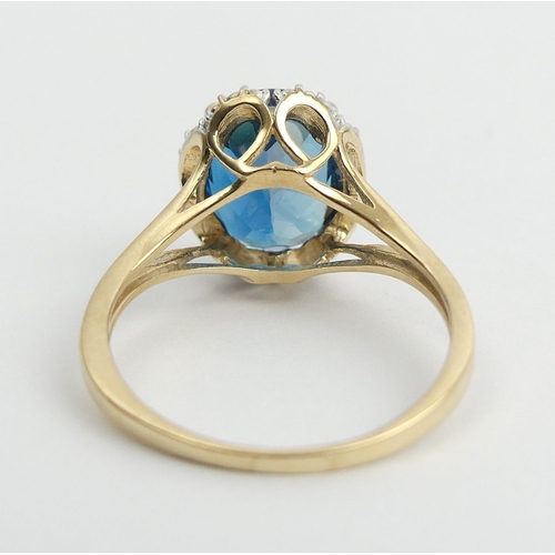 8 - 9ct gold blue topaz ring, 2.9 grams. Size N 1/2, 11 mm. UK Postage £12.