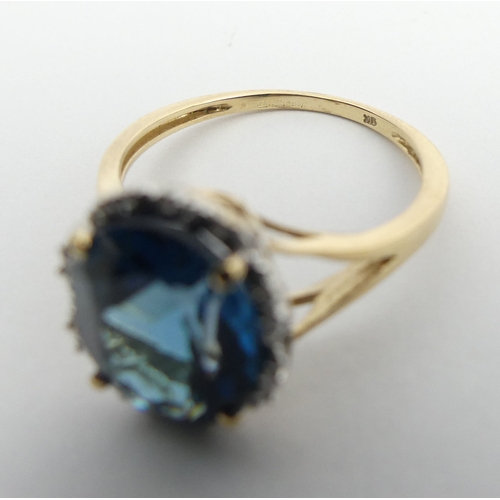 8 - 9ct gold blue topaz ring, 2.9 grams. Size N 1/2, 11 mm. UK Postage £12.