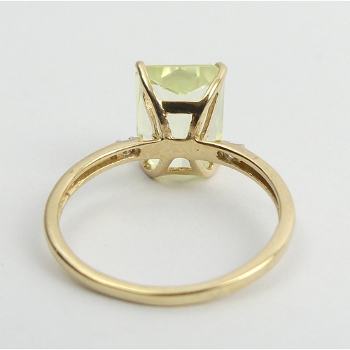 9 - 9ct gold canary kunzite and diamond ring, 2.1 grams. Size N 1/2, 11 mm. UK Postage £12.