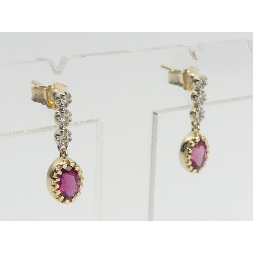 25 - A pair of 9ct gold rubellite and diamond earrings, 2 cm long. UK Postage £12.